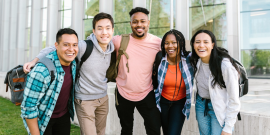 Five students together on campus